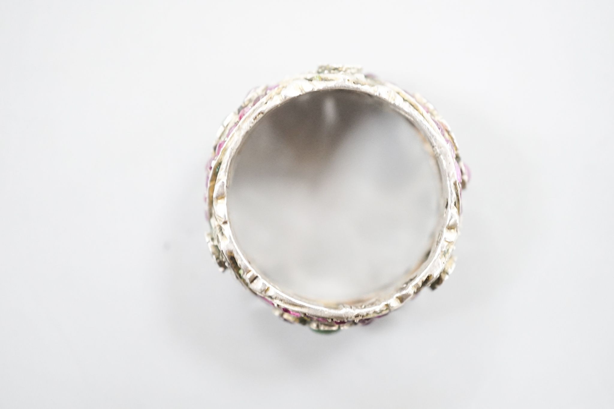 A 19th century Austro-Hungarian pierced white metal, diamond and gem set band, size W/X.